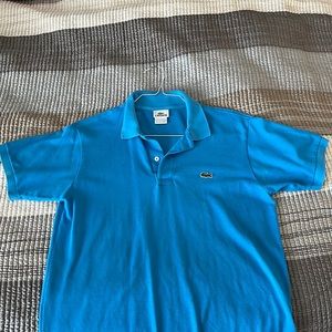 Lacoste blue polo. Size 4 / small.
